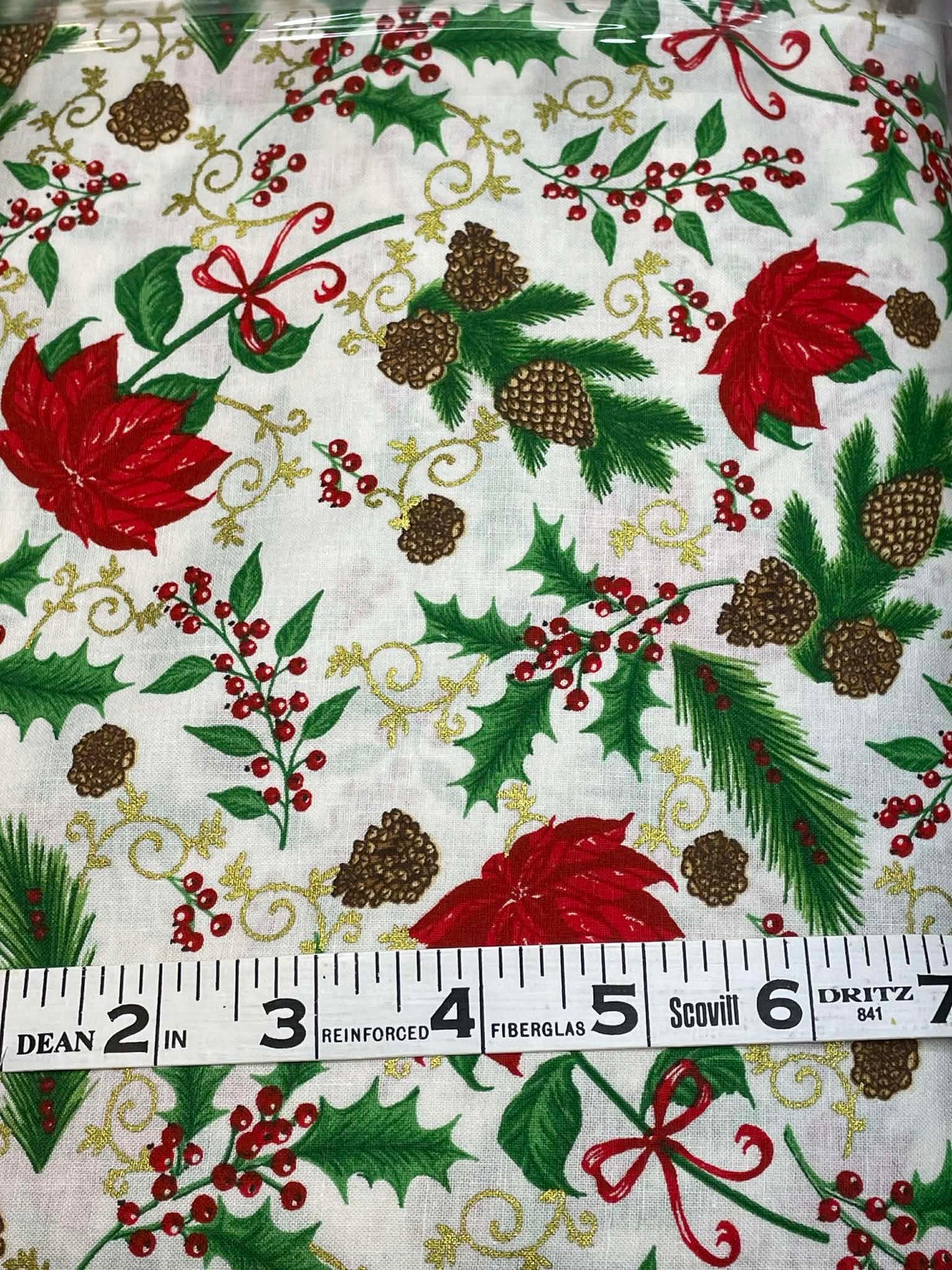 Poinsettias and holly on white background. Sold by the yard