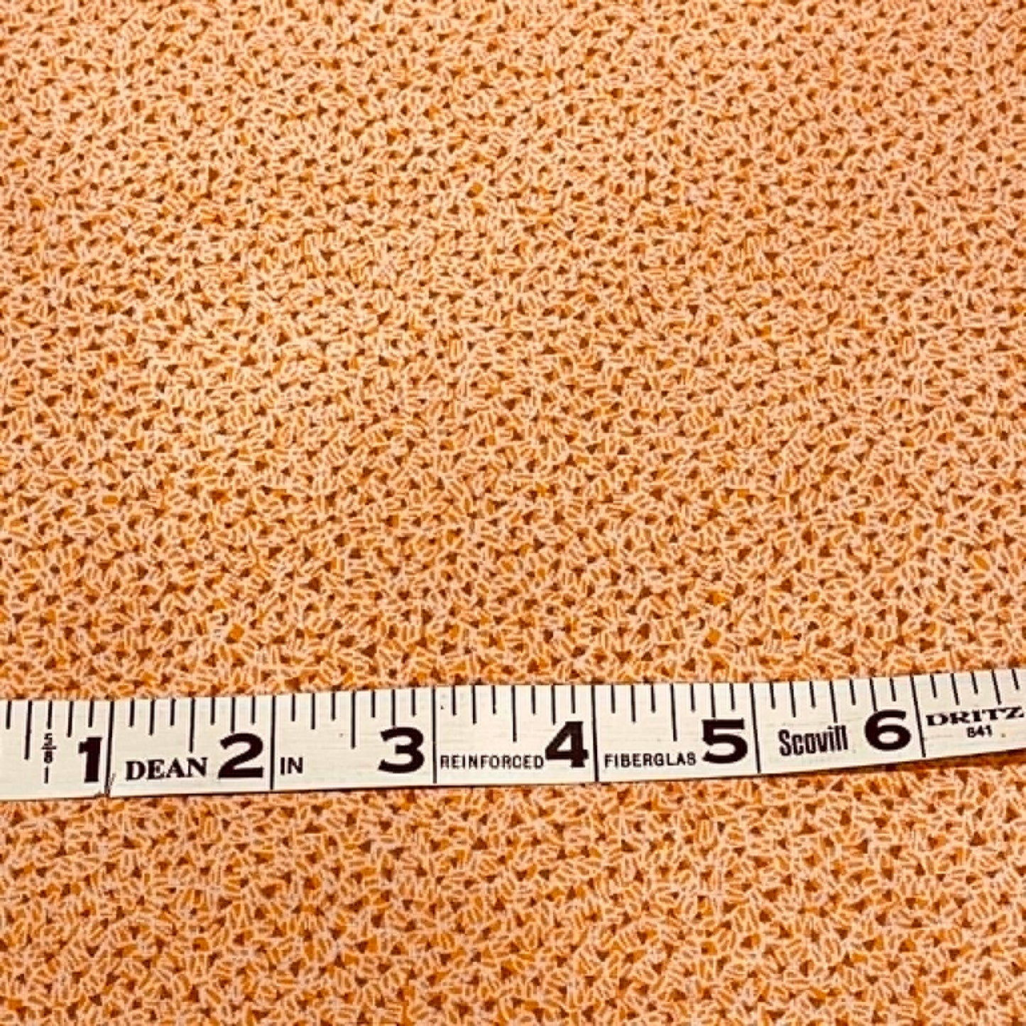 Orange geometrics. Sold by the half yard.