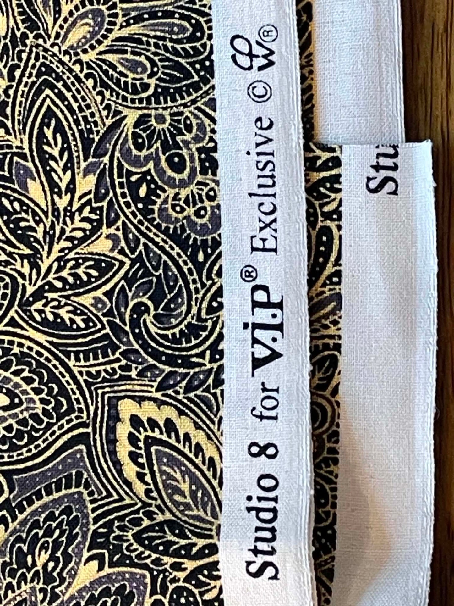 Studio 8, black and yellow paisley. Sold by the yard.