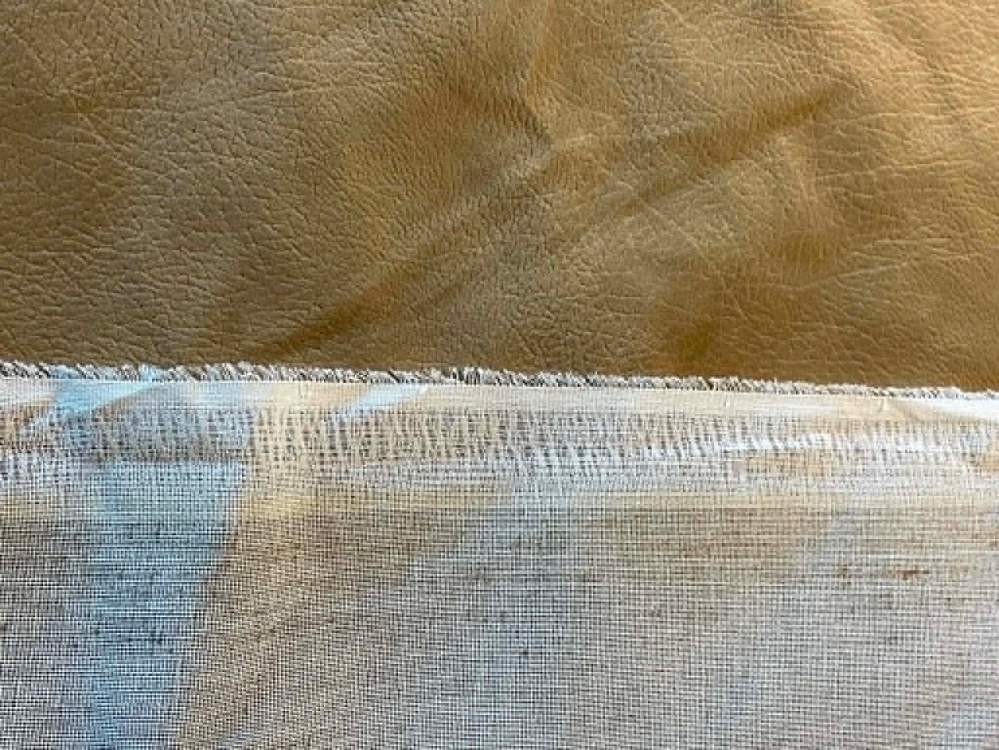 Tan faux suede. 54" wide. Sold by the half yard.