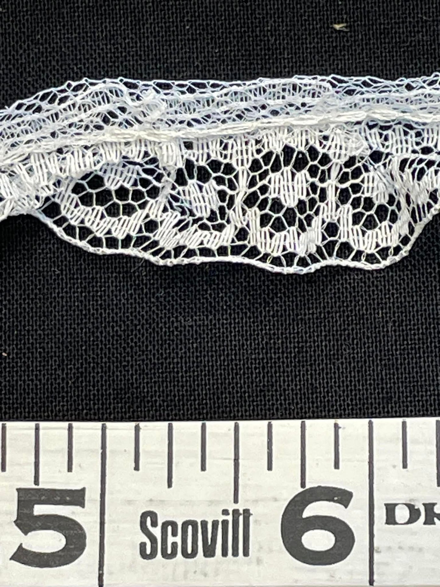 1" wide ruffled lace trim. Sold by the yard.
