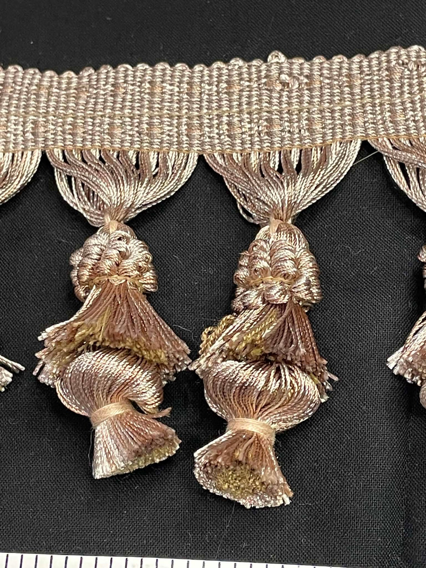 4" wide double tassel fringe trim. Sold by the yard.