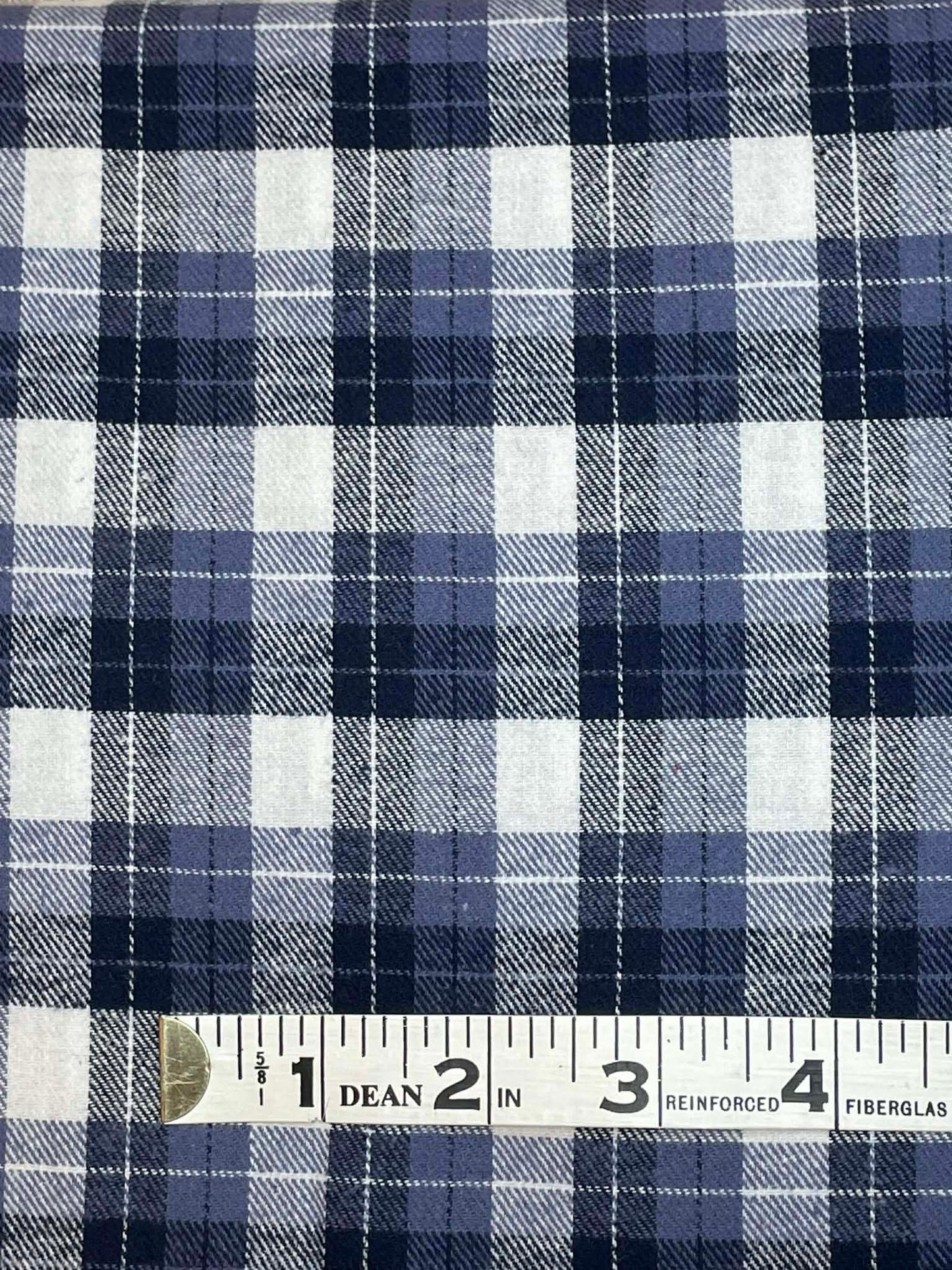 Ozark Mountain flannel. Yarn dyed blue and white plaid. Sold by the yard.