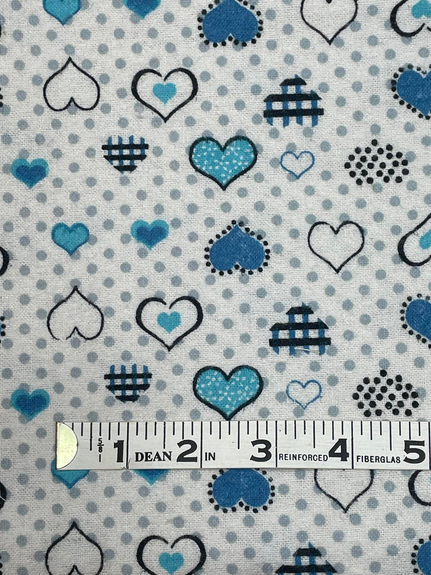 Flannel blue hearts and gray dots. Sold by the half yard.