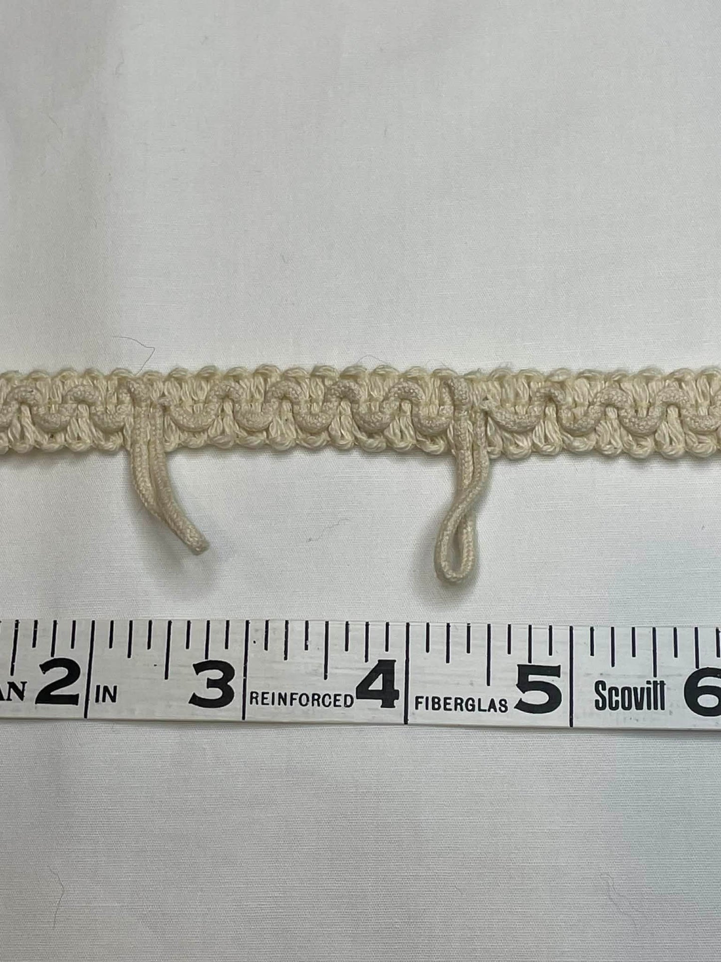 Braided Button Loop Trim. Sold by the half yard.