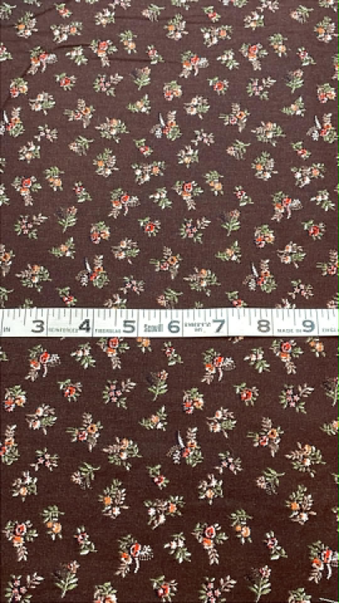 Vintage floral on dark brown background.  Sold by the half yard.