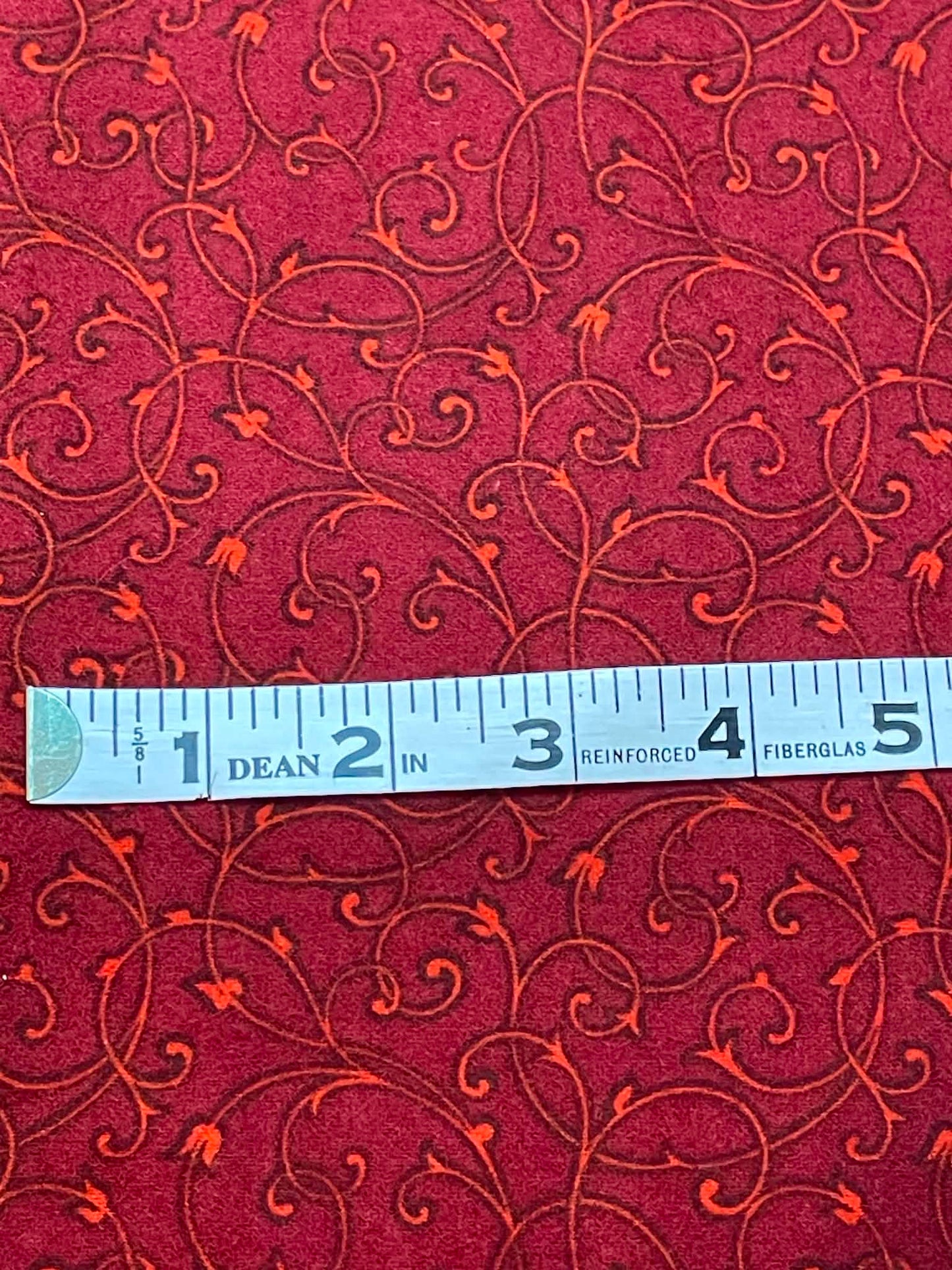 Flannel.  Deep red with swirls.  Sold by the yard.