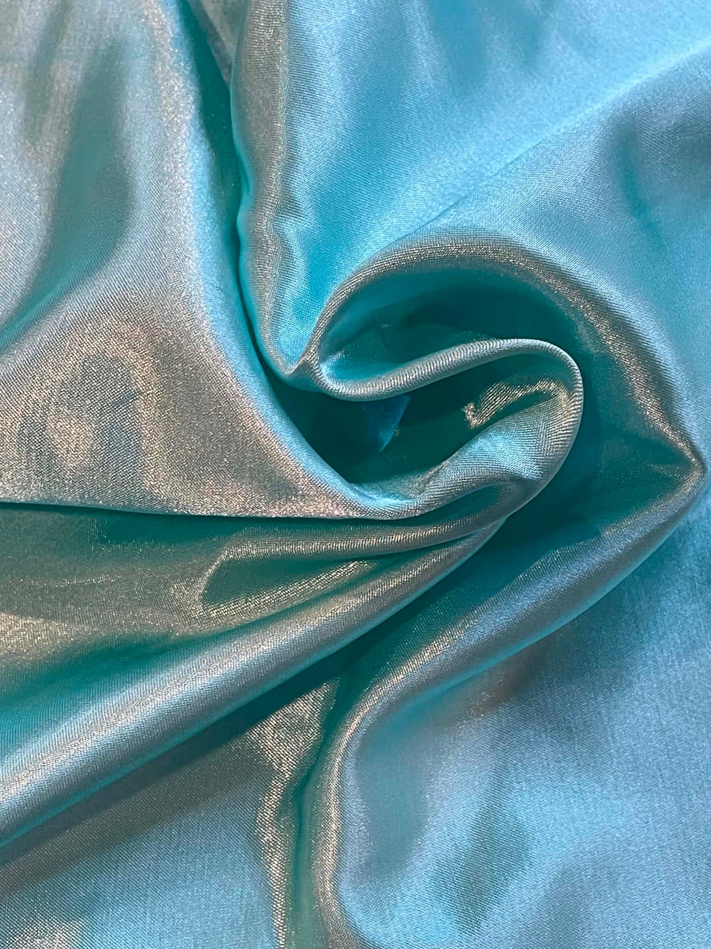 Aqua blue satin.  Sold by the yard.