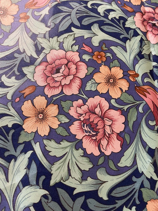 Interior upholstery fabric.  Peach and pink floral with a nice sheen.  Sold by the yard.