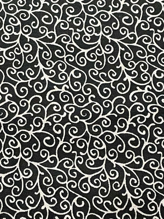 Gray swirls on black background.  Sold by the yard.