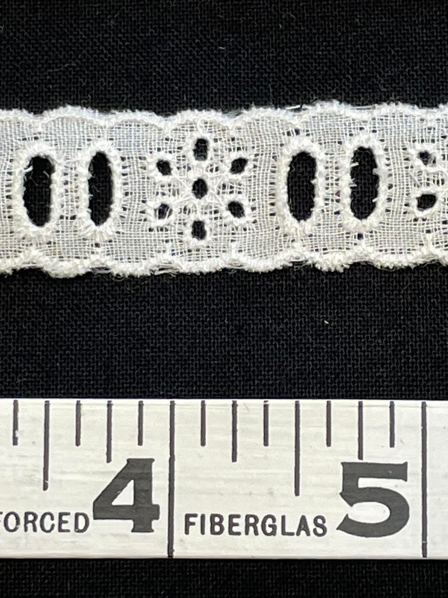 3/4" wide eyelet lace trim.  Sold by the half yard.