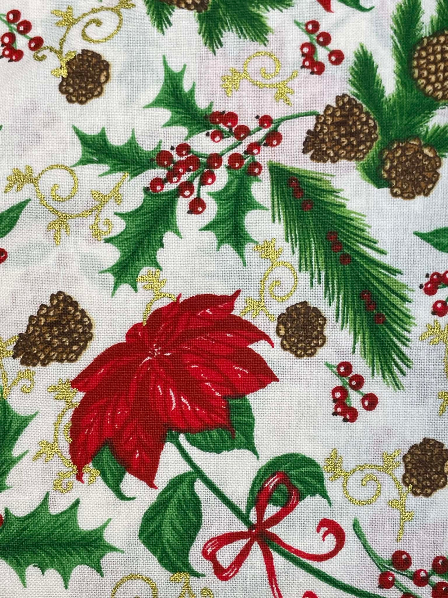 Poinsettias and holly on white background.  Sold by the yard