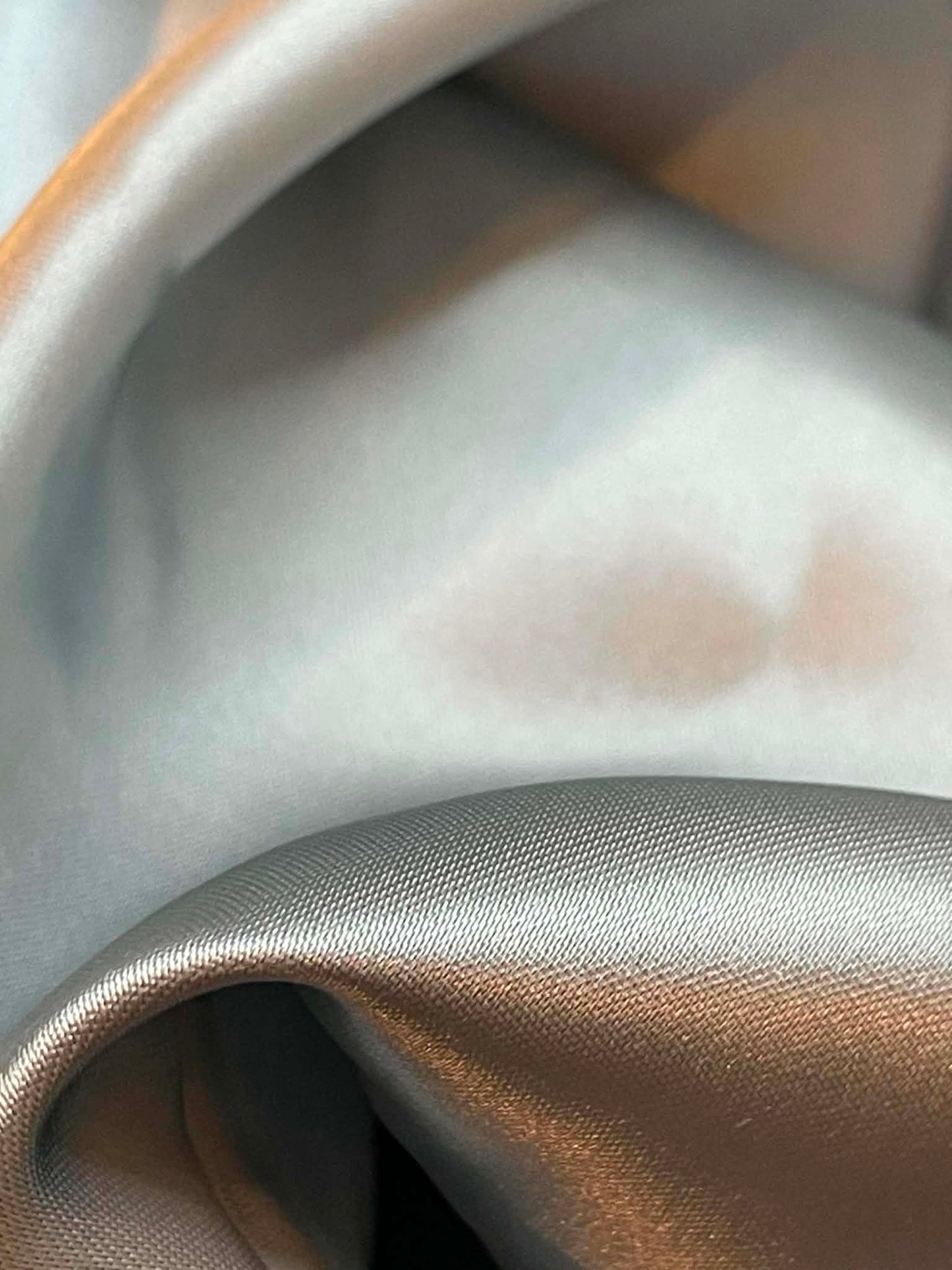 Light silver blue satin.  Sold by the yard.