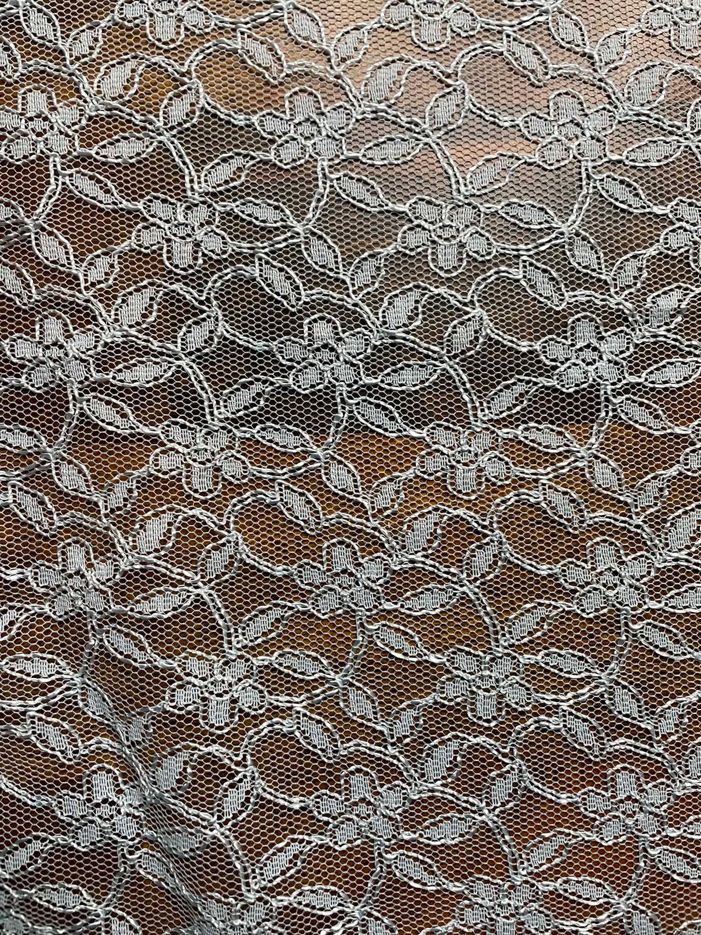 Baby blue floral all over lace.   Sold by the yard.