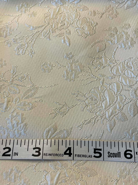 Cream colored satin jacquard.  Sold by the yard.