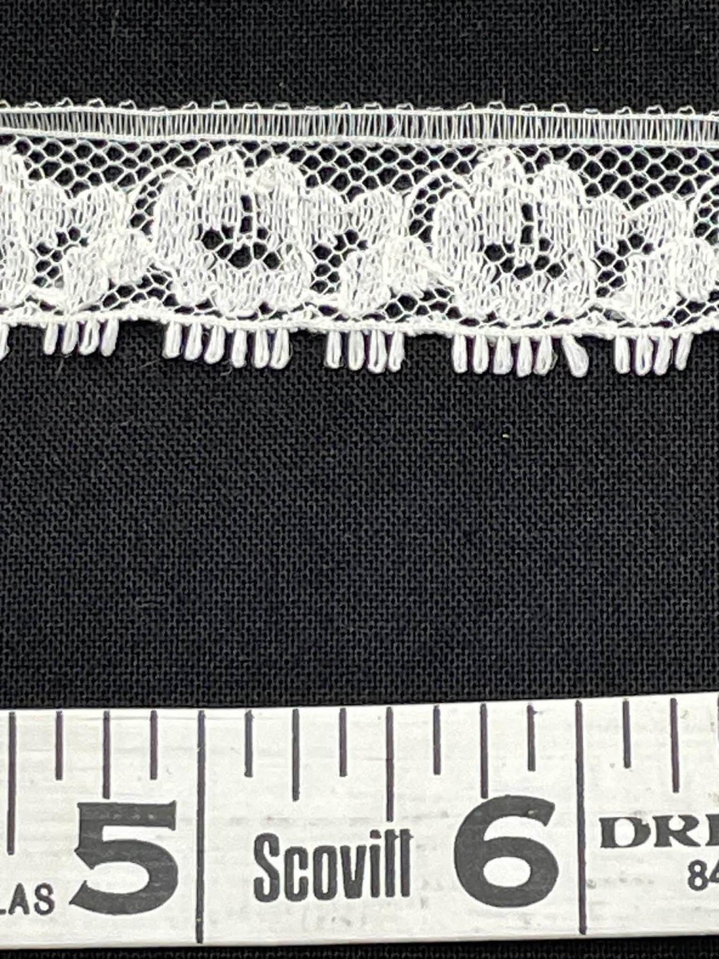 3/4" wide eyelash lace.  Sold by the yard.