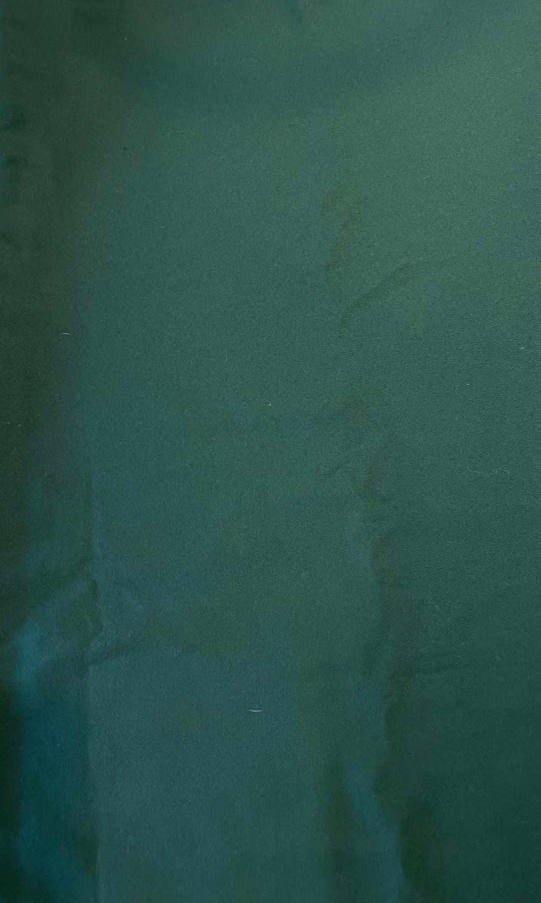 Dark green heavy weight crepe fabric.  Sold by the yard.