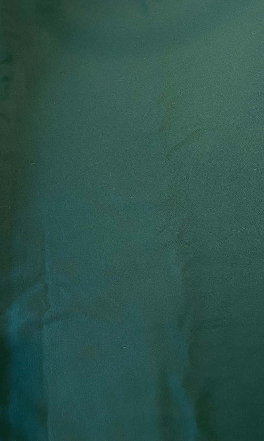 Dark green heavy weight crepe fabric.  Sold by the yard.