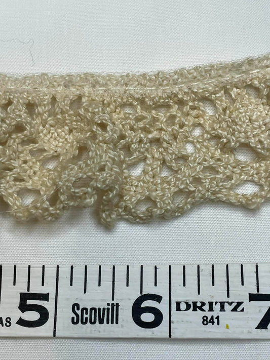 1 1/2" wide.  Crochet lace trim.  Sold by the yard.