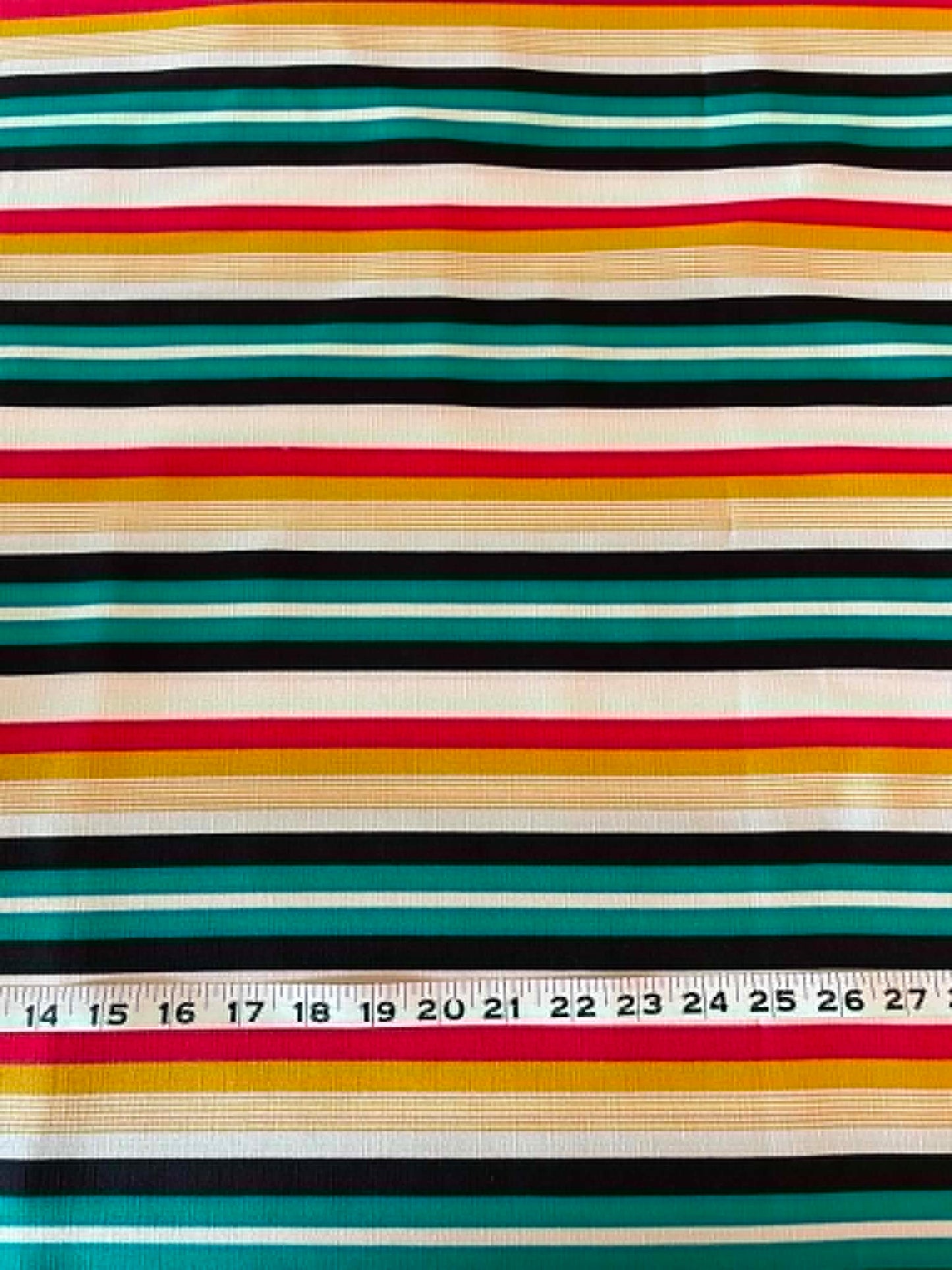 Green, red, yellow, black and white stripes.  Polyester crepe.  ** REMNANT **