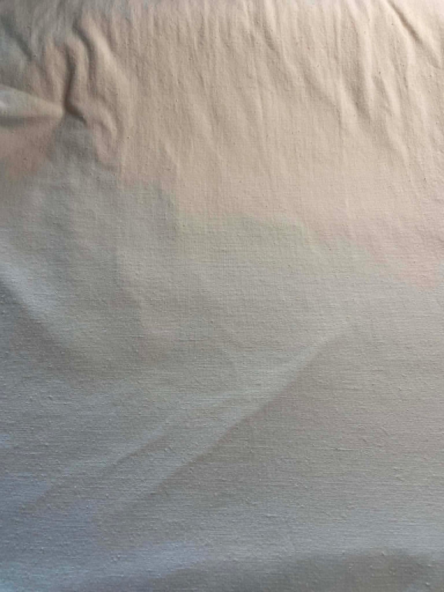 Heavy (12 oz) cotton cream color weave.  Sold by the half yard.