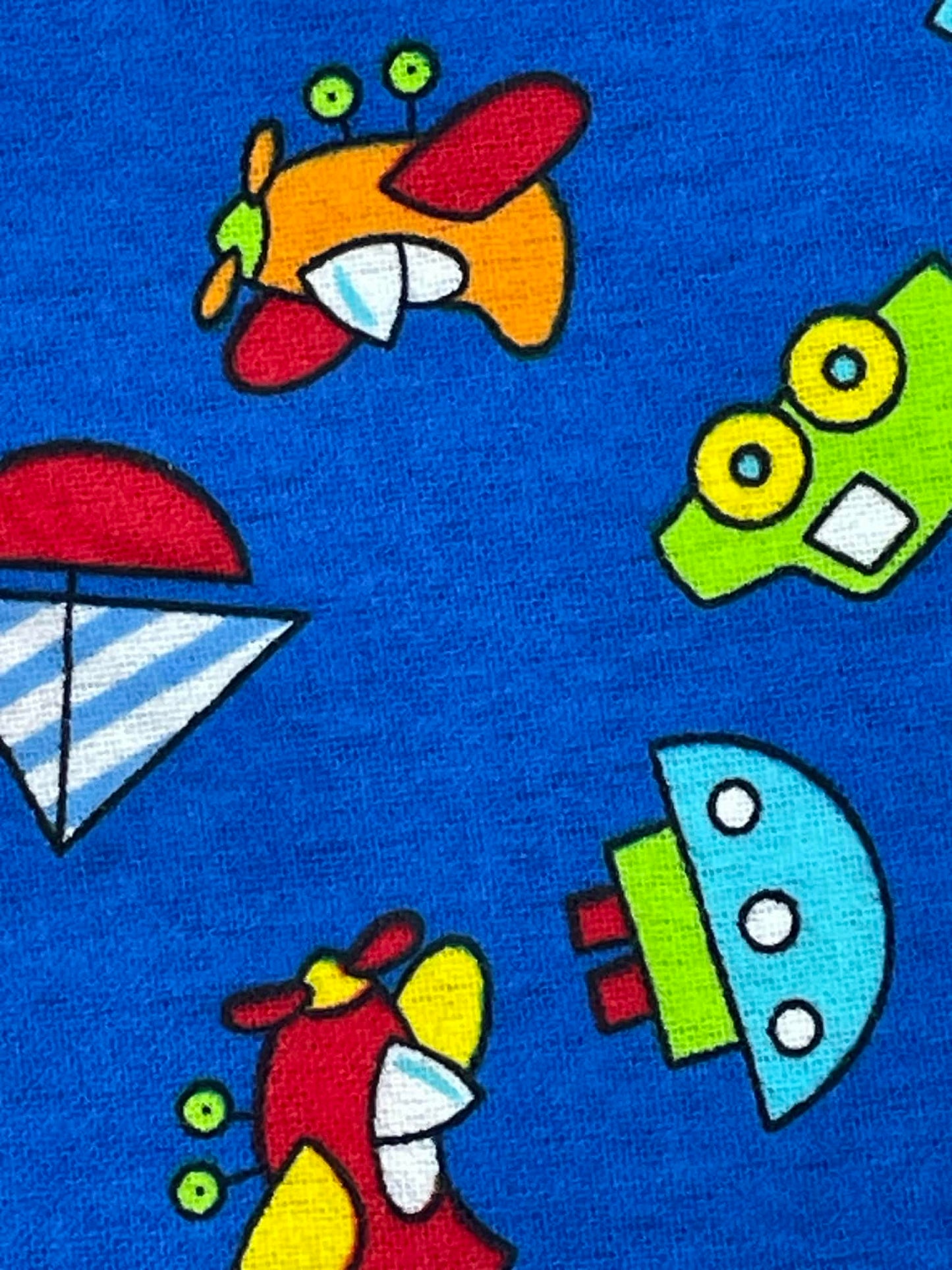 Flannel print.  Toys on navy blue background.  Sold by the yard.