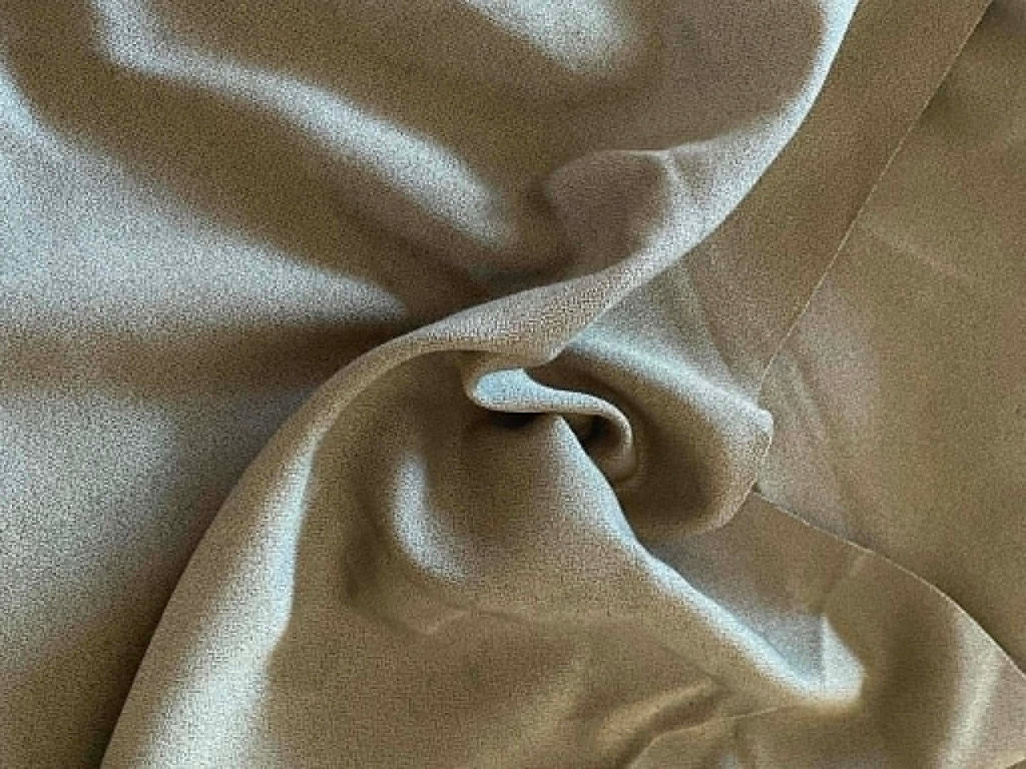 Greenish colored heavy apparel crepe fabric.  Sold by the yard.