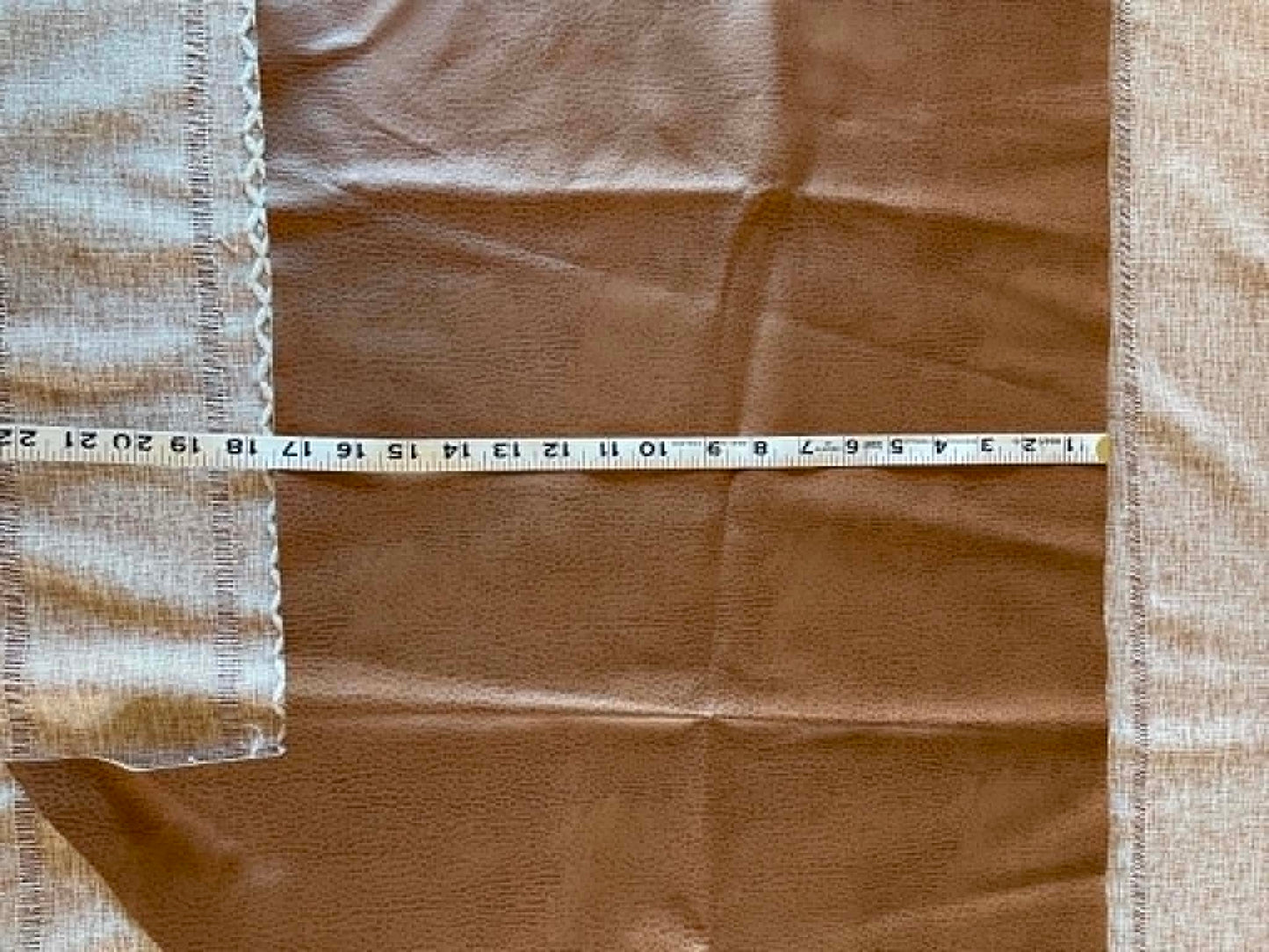 Remnant.  Tan textured faux leather