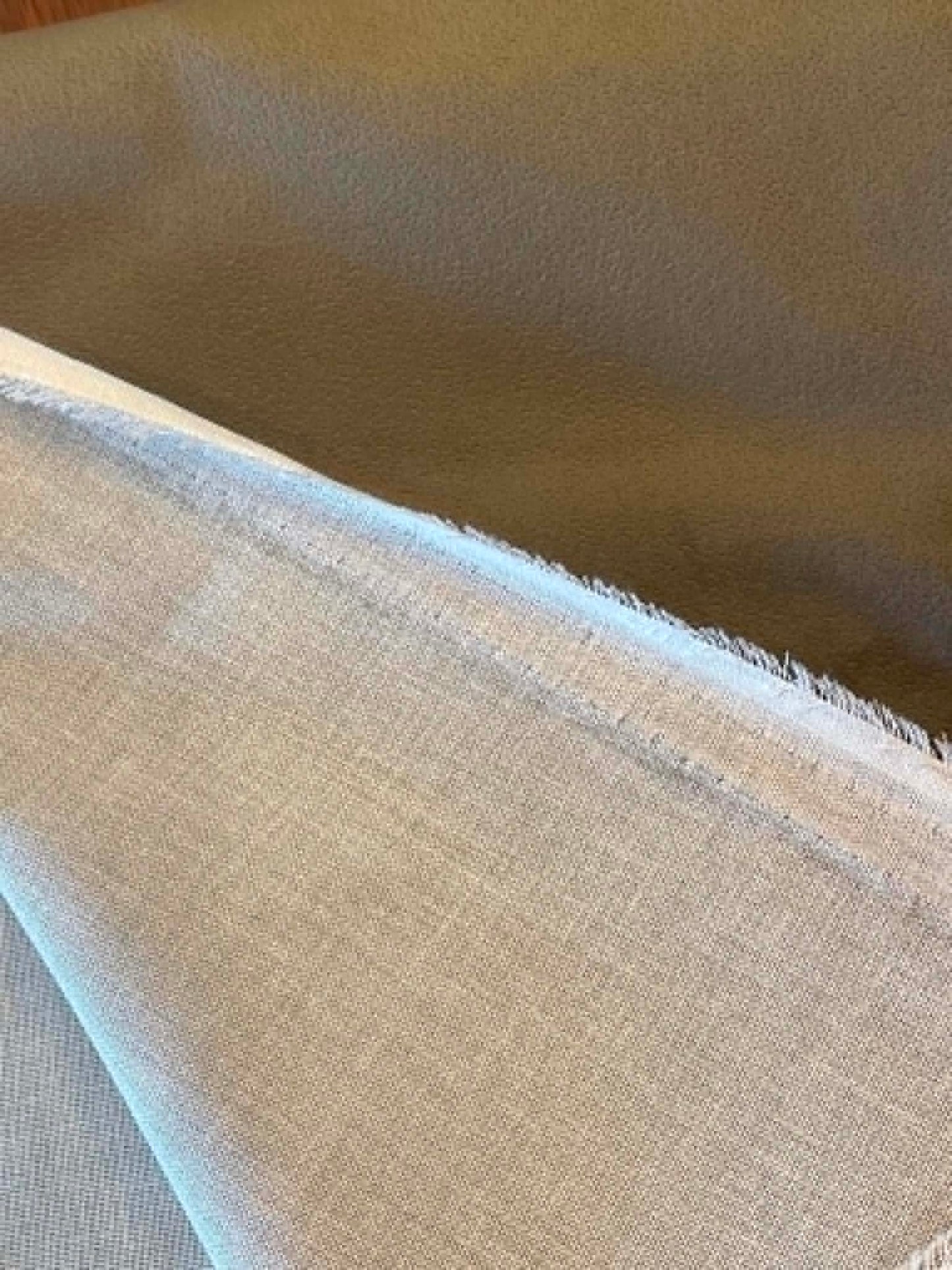 Dark green, suede like upholstery fabric.  Sold by the yard.