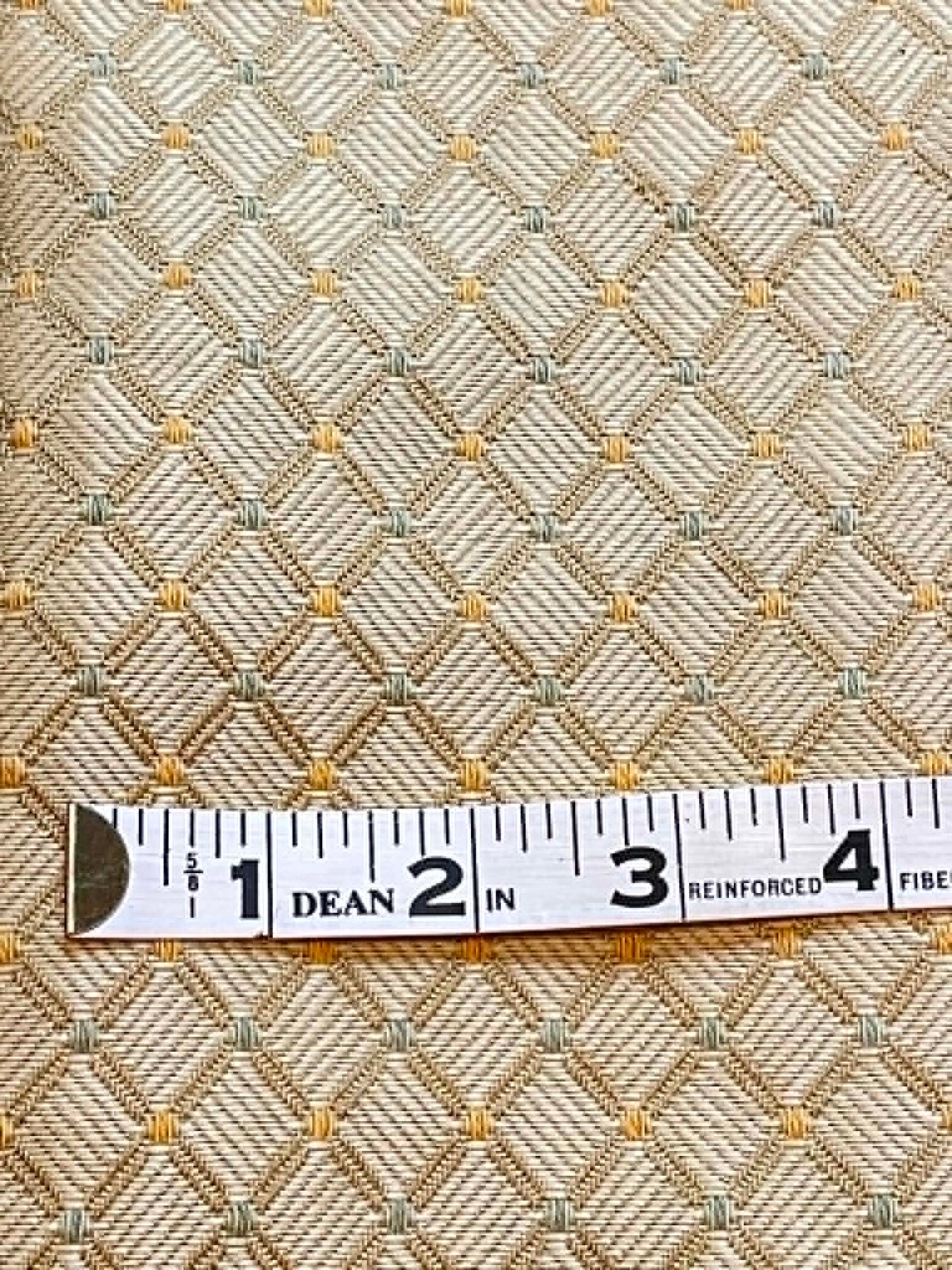 54" wide upholstery fabric.  Yellow/gold diamond with a bit of green.  Sold by the yard.
