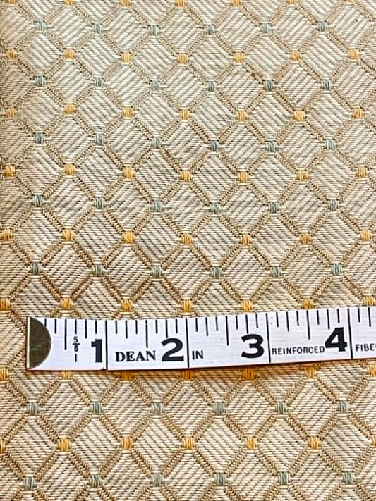 54" wide upholstery fabric.  Yellow/gold diamond with a bit of green.  Sold by the yard.
