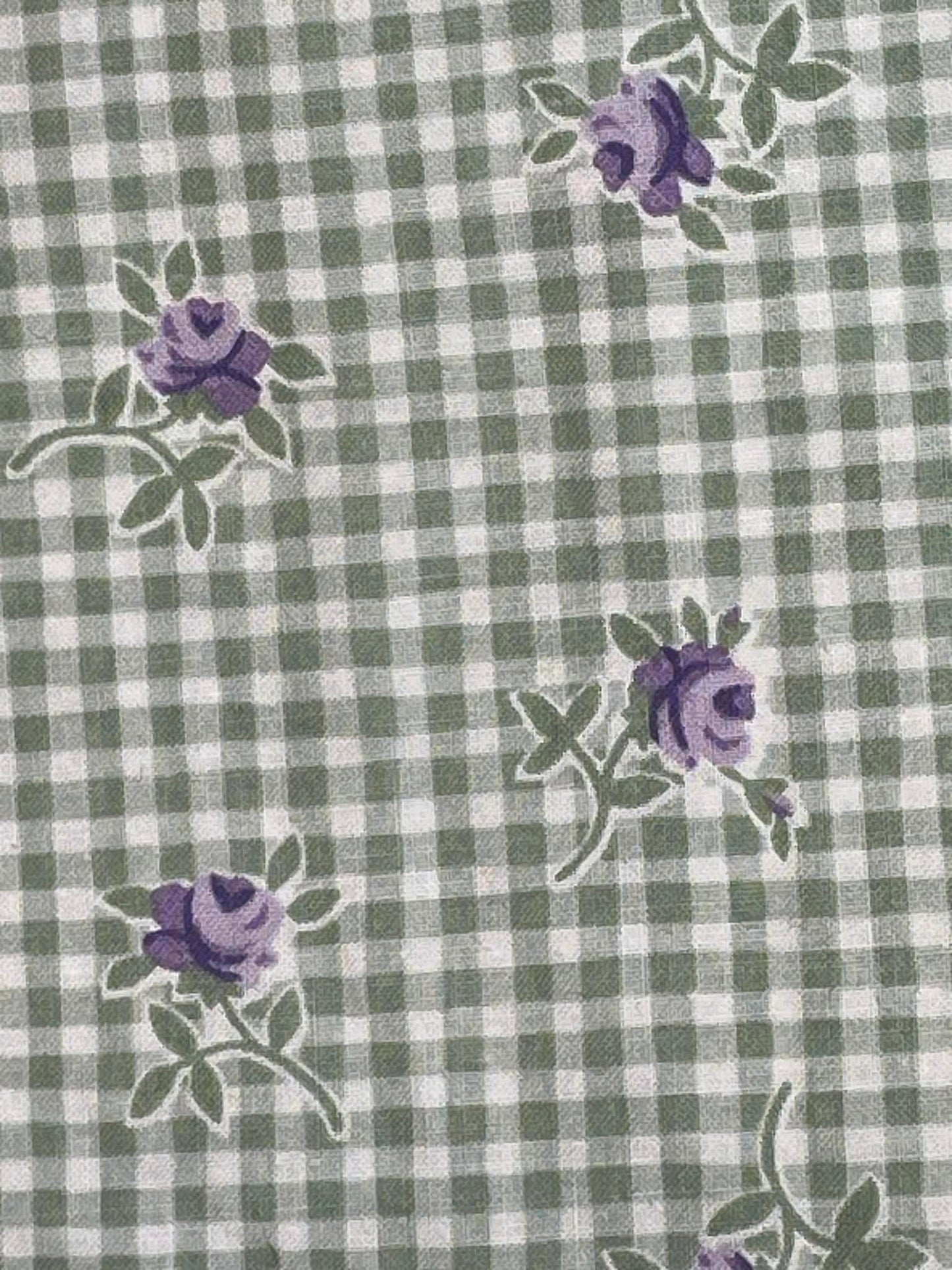 Purple flowers on green and white check background.  Sold by the half yard.