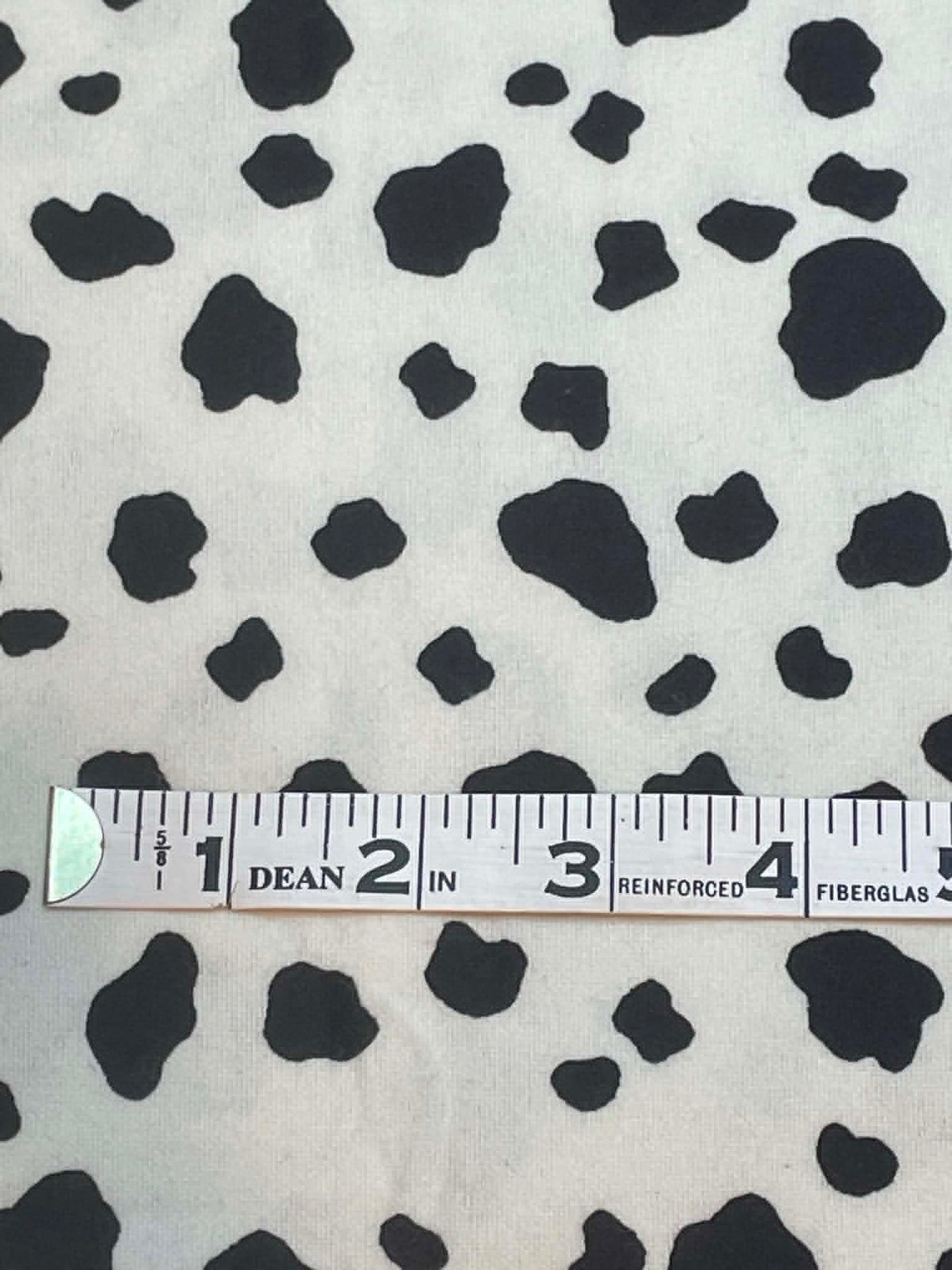 Flannel.  Black and white cow hide print.  Sold by the half yard.