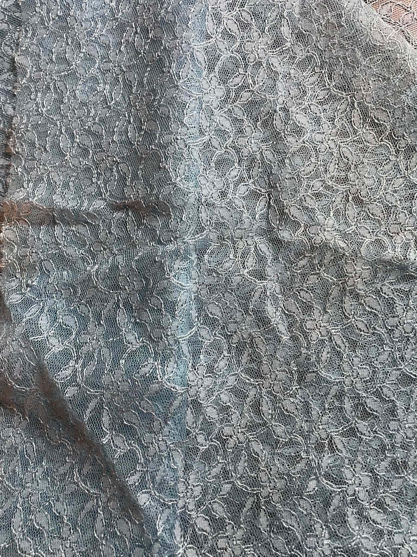 Baby blue floral all over lace.   Sold by the yard.