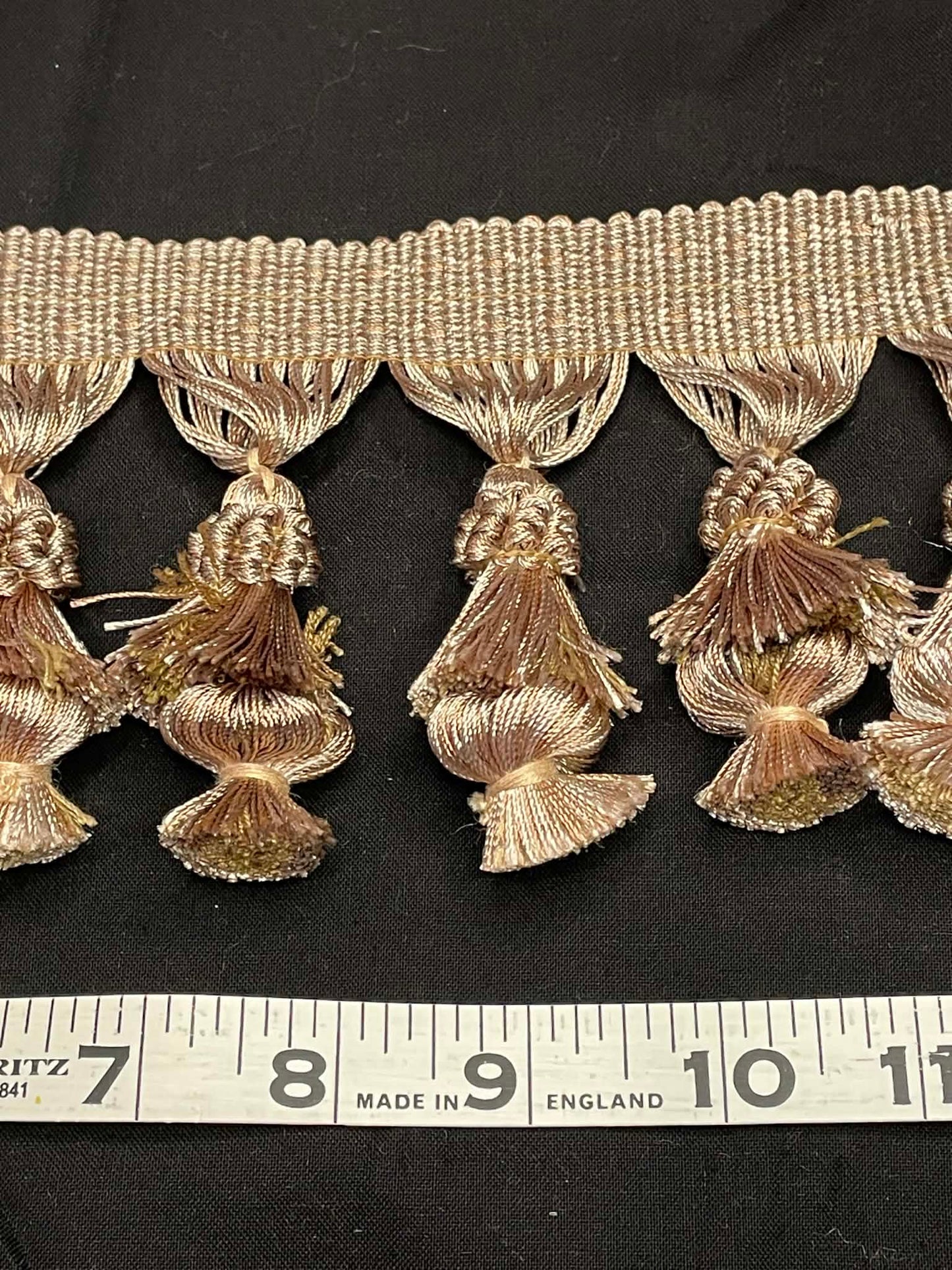 4" wide double tassel fringe trim.  Sold by the yard.