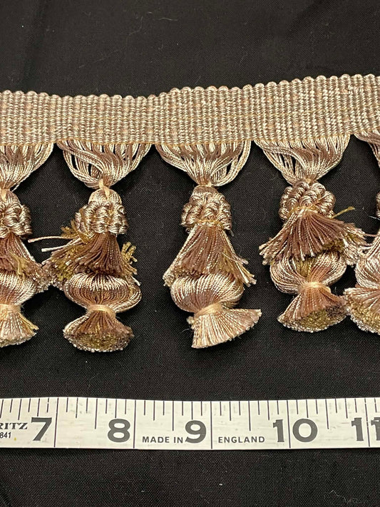 4" wide double tassel fringe trim.  Sold by the yard.