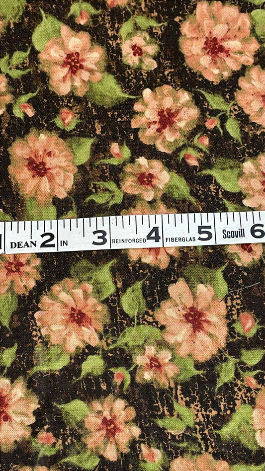 Pinkish flowers, green leaves on dark background that looks like cracked paint