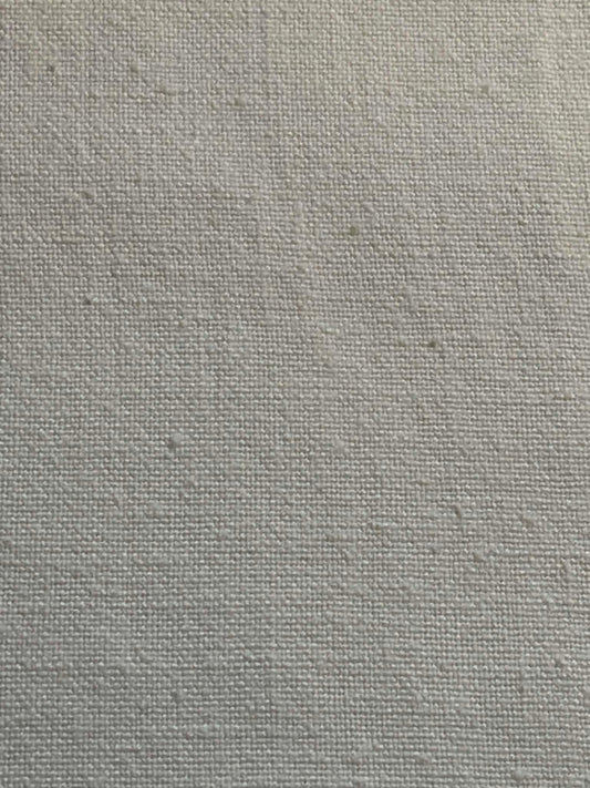 Heavy (12 oz) cotton cream color weave.  Sold by the half yard.