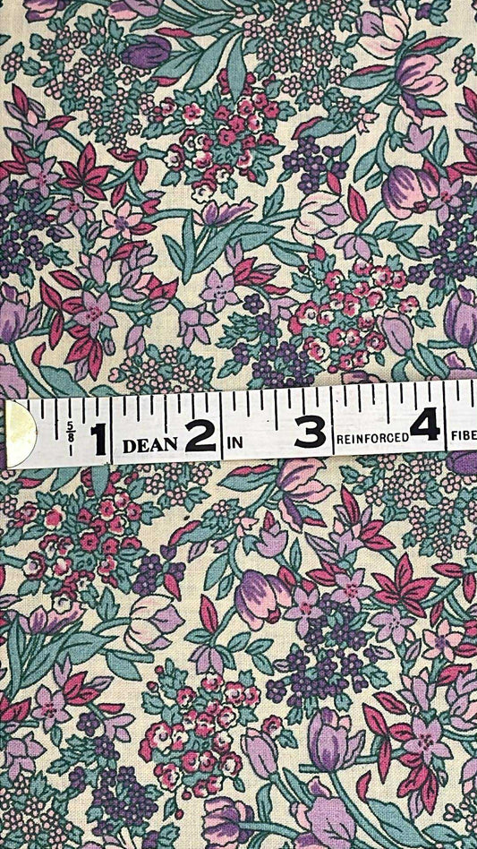 Pink and purple flowers with green leaves on beige background