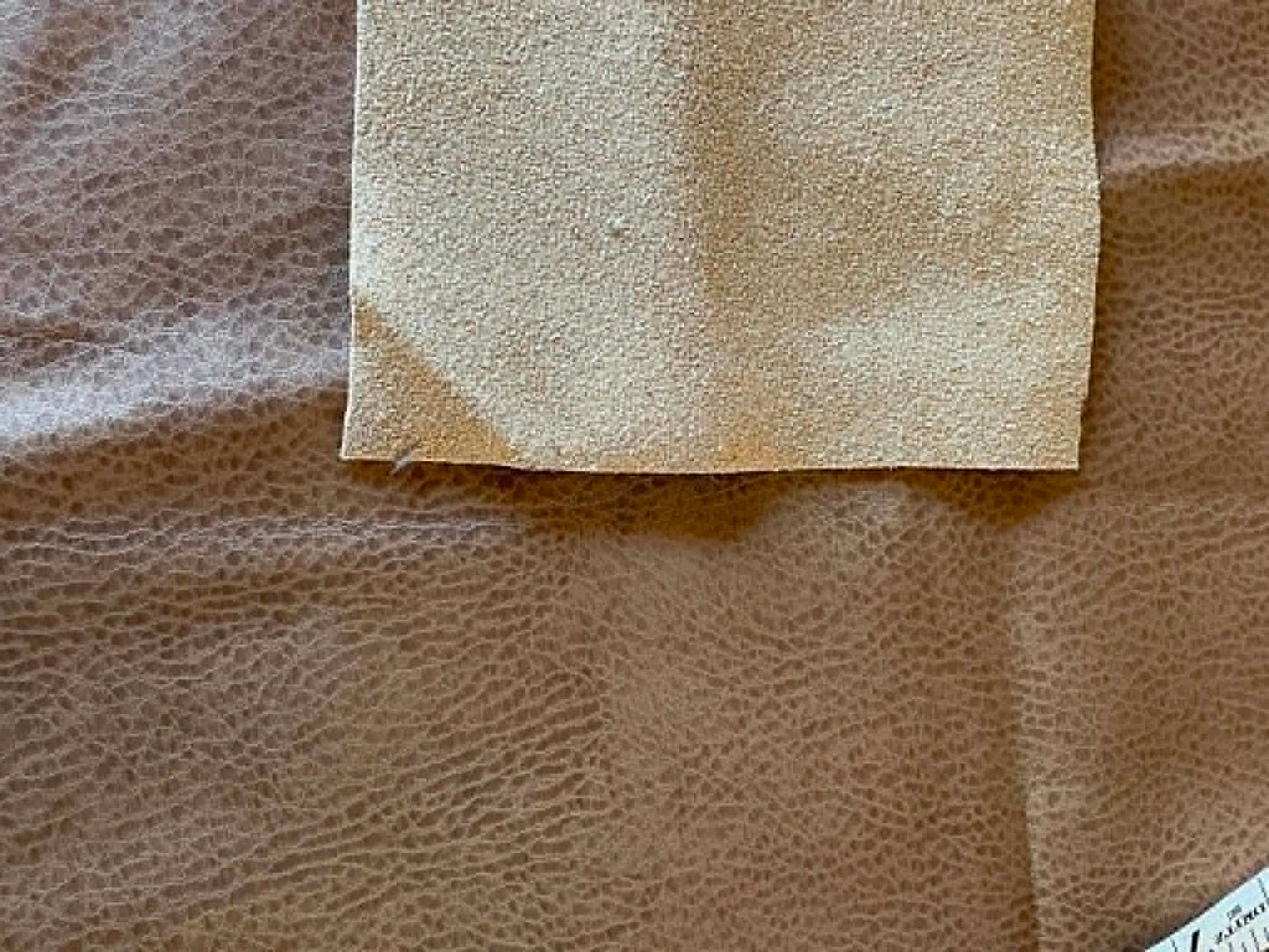 Remnant.  Tan textured faux leather