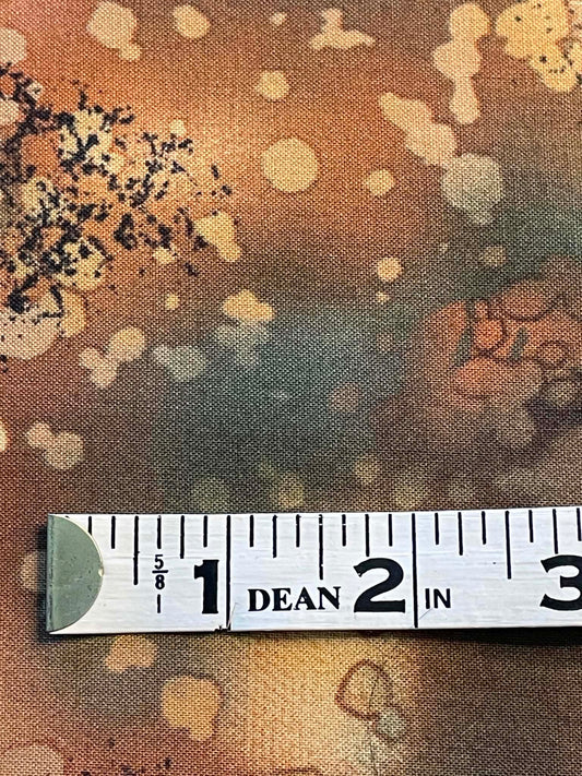 Fossil Fern.  Multi colored greens and tans with leaves and watermark.  Sold by the yard.