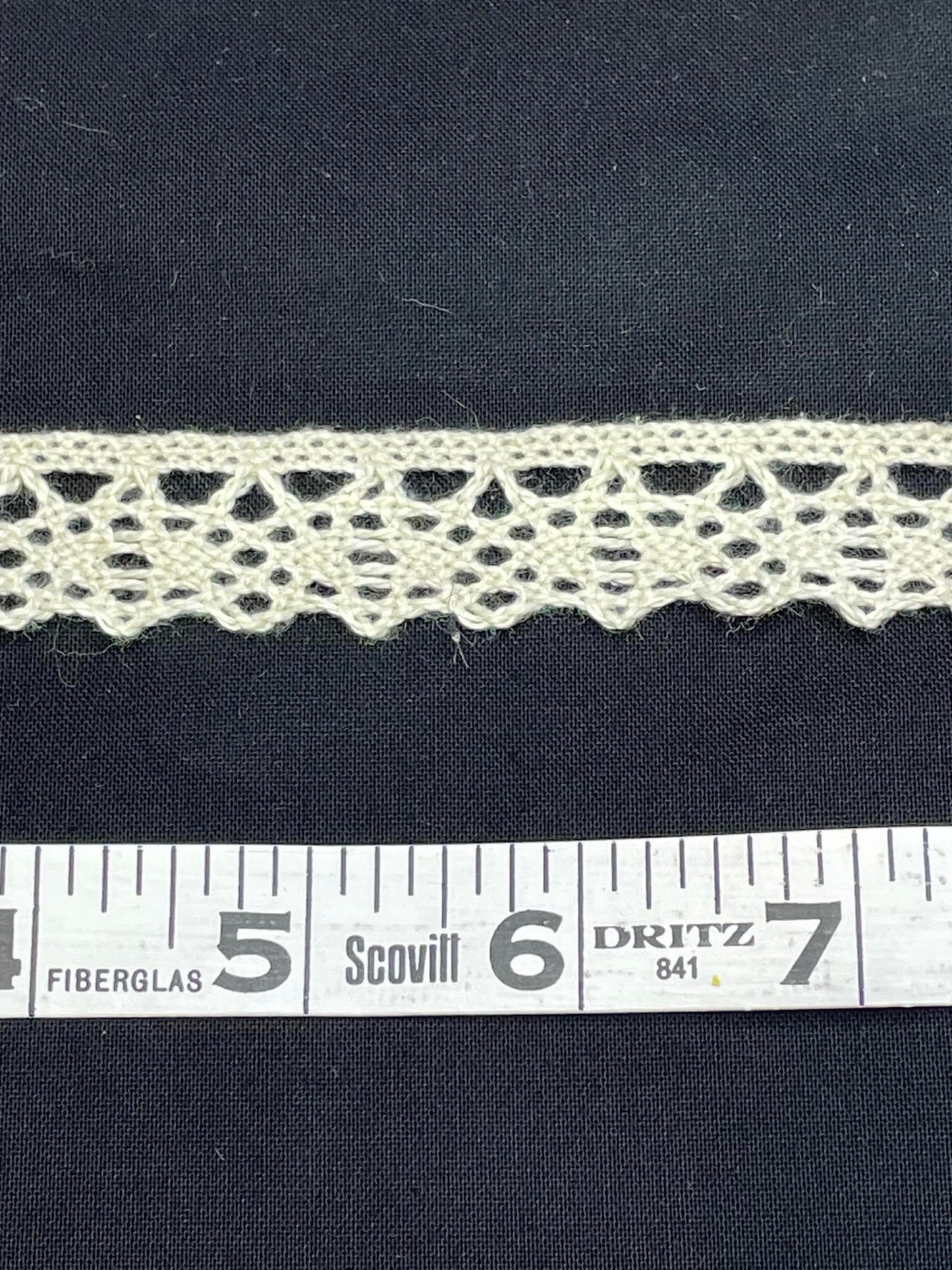 3/4" wide natural cotton cluny lace.  Sold by the yard.
