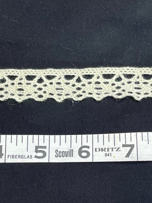 3/4" wide natural cotton cluny lace.  Sold by the yard.