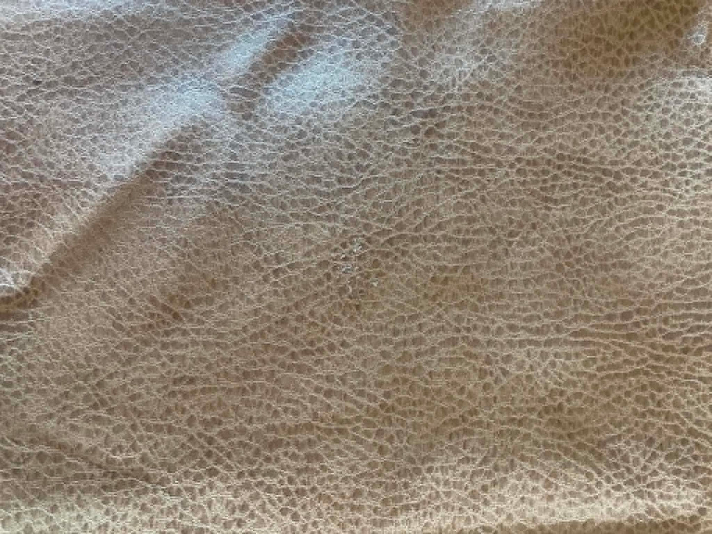Remnant.  Tan textured faux leather