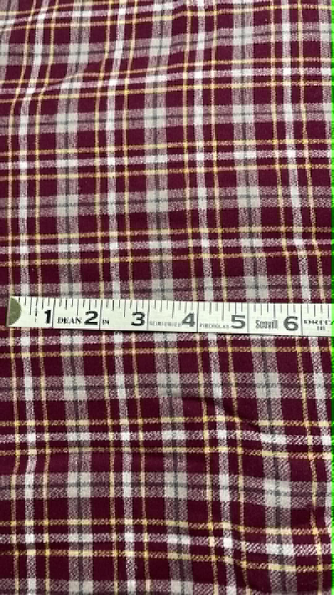 Ozark Mountain flannel.  Burgundy with white, gray and yellow.  Sold by the yard.