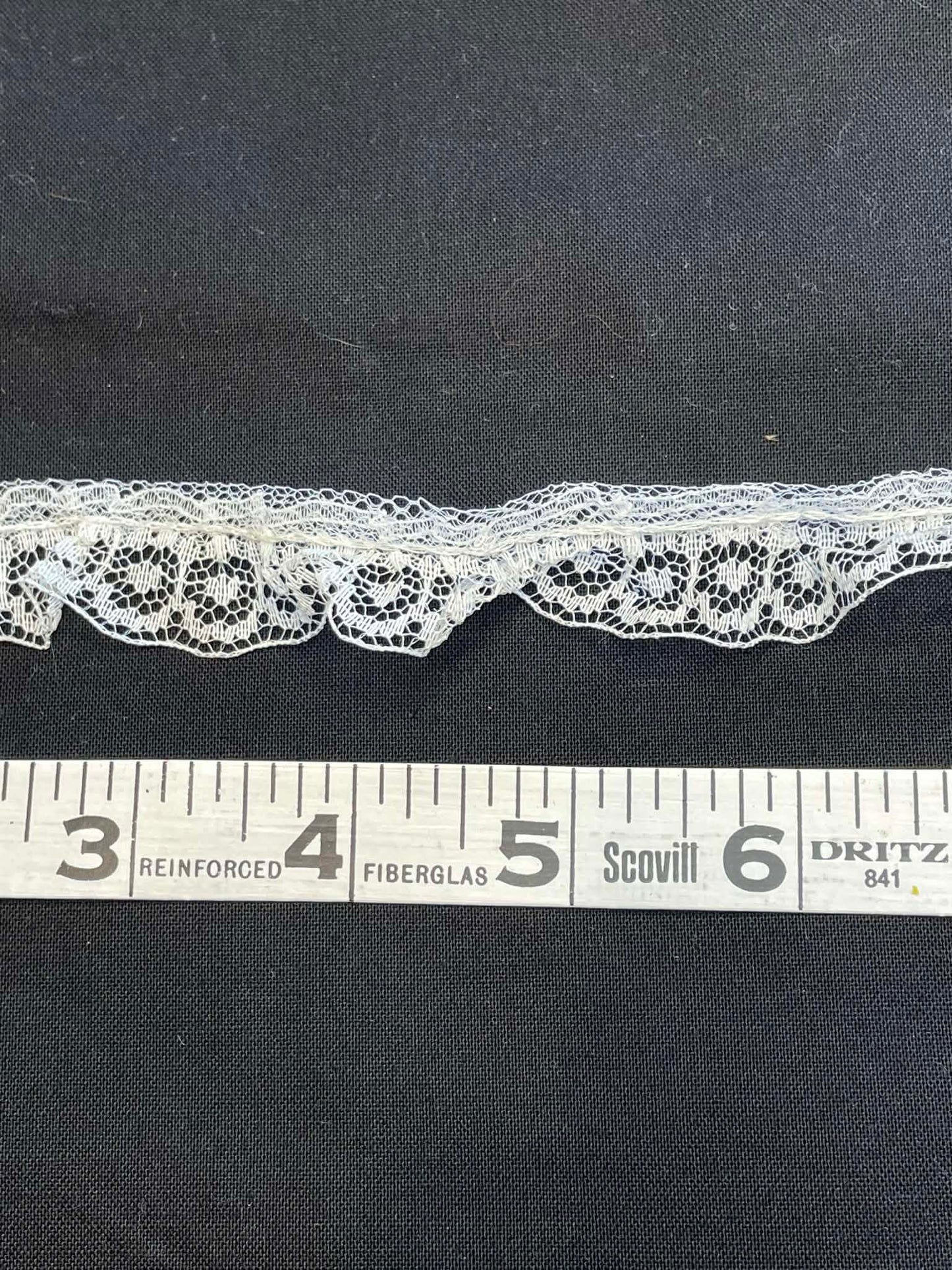 1" wide ruffled lace trim.  Sold by the yard.