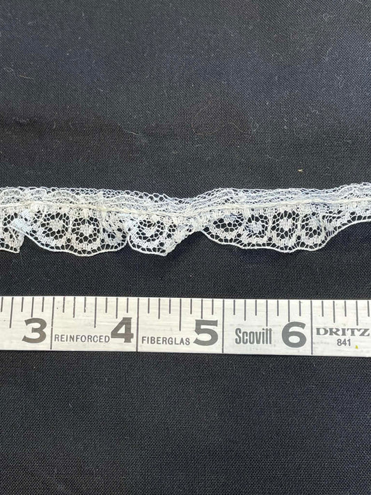 1" wide ruffled lace trim.  Sold by the yard.