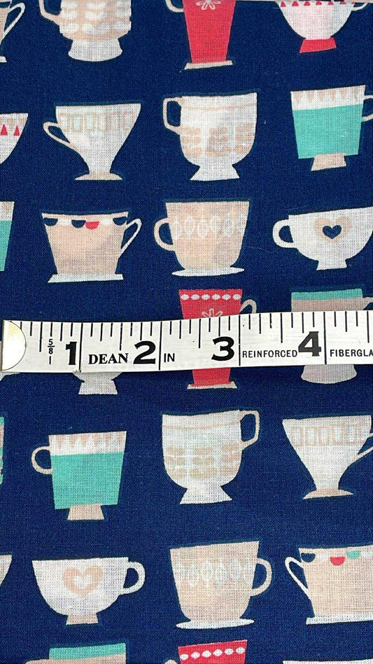 Teacups on navy blue background