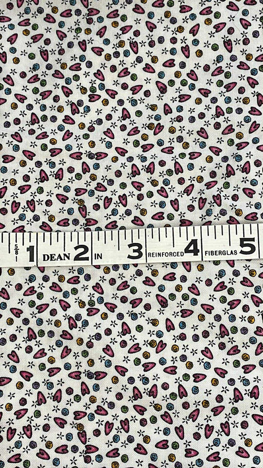Elongated pink hearts and different colored swirls on white background