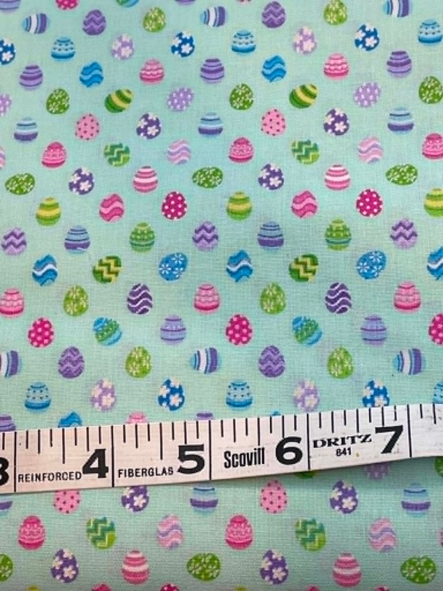 Spring Fling - Studio Cottons.  Patterned Easter Eggs on Turquoise.  Sold by the 1/2 yard.